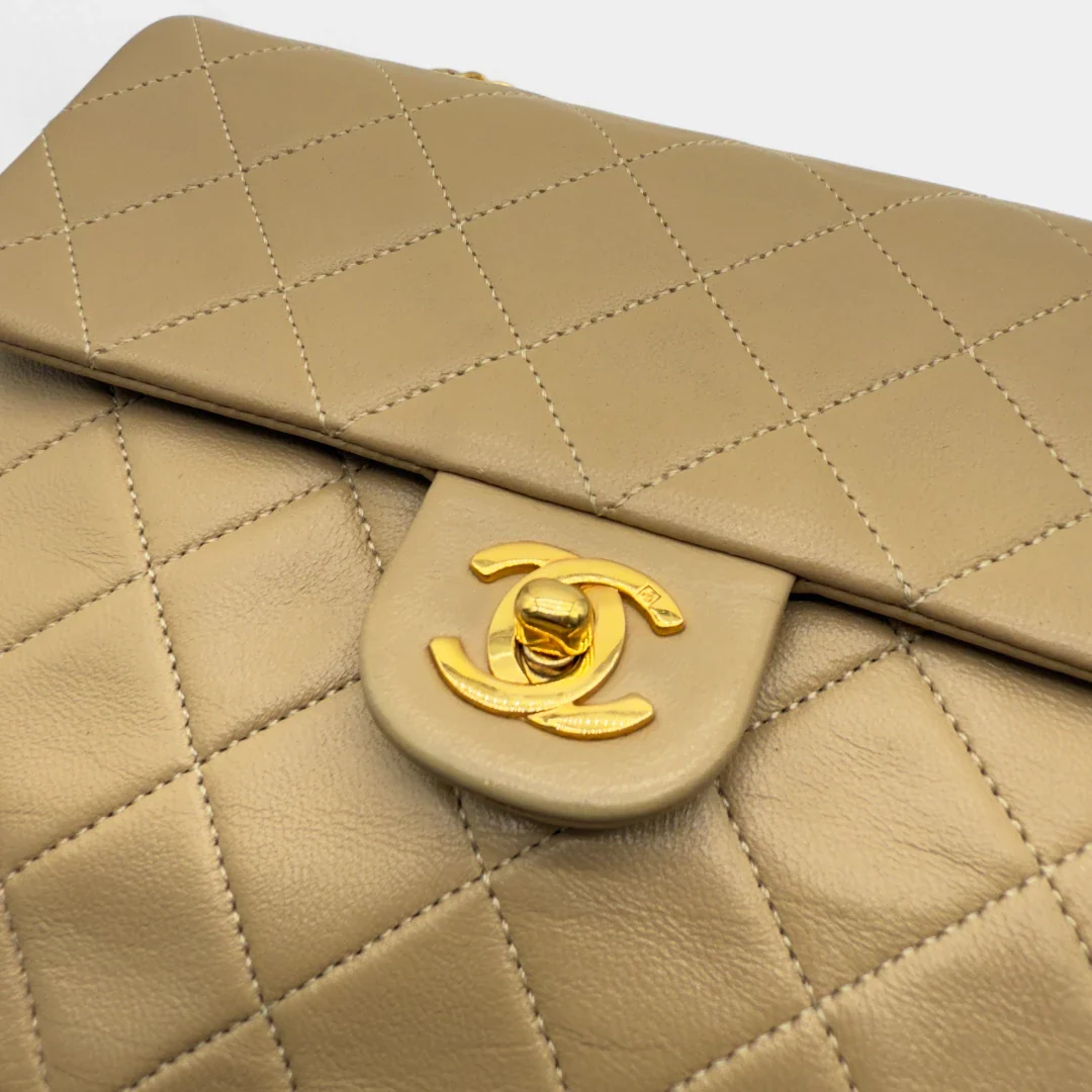 https://cdn.shopify.com/s/files/1/0564/9376/8855/files/Chanel_Flap_Bag-Beige5201.webp?v=1754669919
