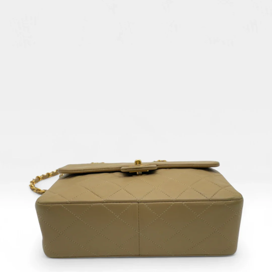 https://cdn.shopify.com/s/files/1/0564/9376/8855/files/Chanel_Flap_Bag-Beige5202.webp?v=1754669919