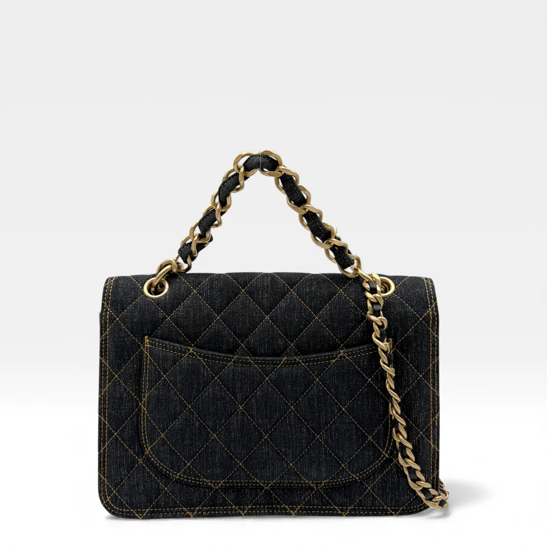 https://cdn.shopify.com/s/files/1/0564/9376/8855/files/Chanel_Flap_Denim_Stoff_schwarz_vintage_5492.webp?v=1765455832