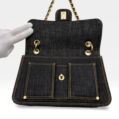 https://cdn.shopify.com/s/files/1/0564/9376/8855/files/Chanel_Flap_Denim_Stoff_schwarz_vintage_5666.webp?v=1765455740