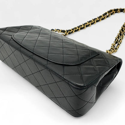 https://cdn.shopify.com/s/files/1/0564/9376/8855/files/Chanel_Handtasche_Double_Flap_25_aus_Lammleder_schwarz_vintage_CC_handbag9878.webp?v=1761872466