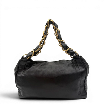 https://cdn.shopify.com/s/files/1/0564/9376/8855/files/Chanel_Schultertasche_Hobo_aus_Lammleder_schwarz_vintage_CC7398.webp?v=1779893943