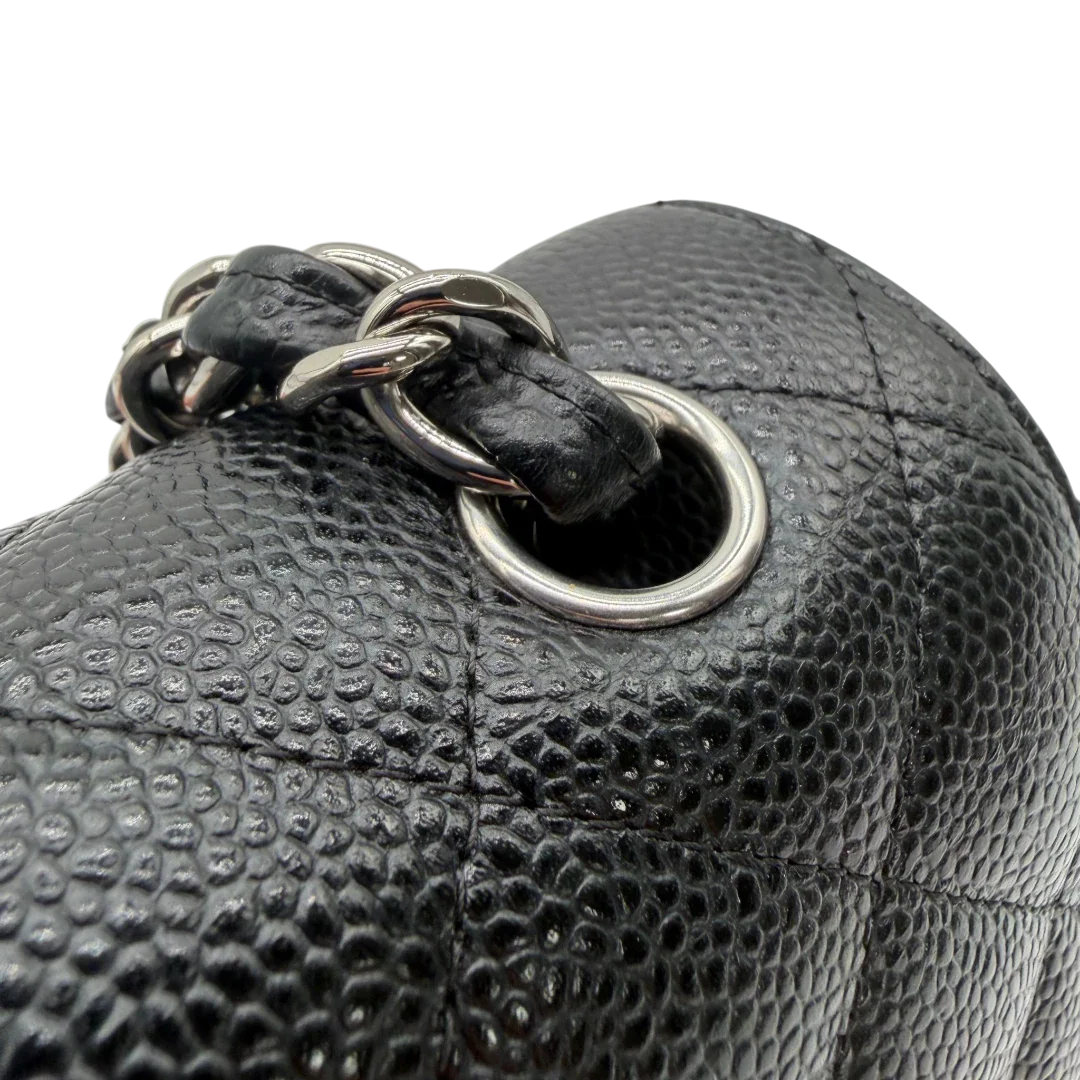 https://cdn.shopify.com/s/files/1/0564/9376/8855/files/Chanel_Timeless_Jumbo_Handtasche_Caviar_Leder_schwarz_vintage_CC3971.webp?v=1775065976