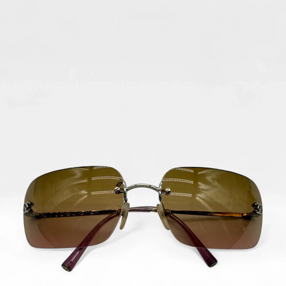 https://cdn.shopify.com/s/files/1/0564/9376/8855/files/Chanel__Sonnenbrille__Rahmenlos__vintage__luxury__CC__sunglasses008.webp?v=1748426611