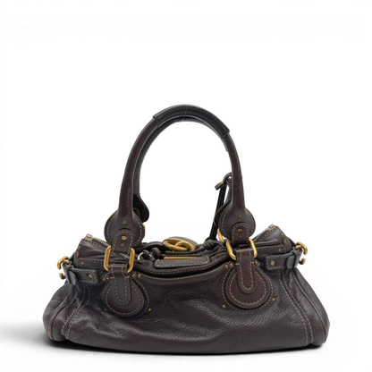 https://cdn.shopify.com/s/files/1/0564/9376/8855/files/Chloe_Handtasche_Paddington_aus_Leder_dunkelbraun_vintage6984.webp?v=1779290033