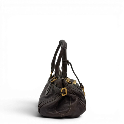 https://cdn.shopify.com/s/files/1/0564/9376/8855/files/Chloe_Handtasche_Paddington_aus_Leder_dunkelbraun_vintage6986.webp?v=1779290033