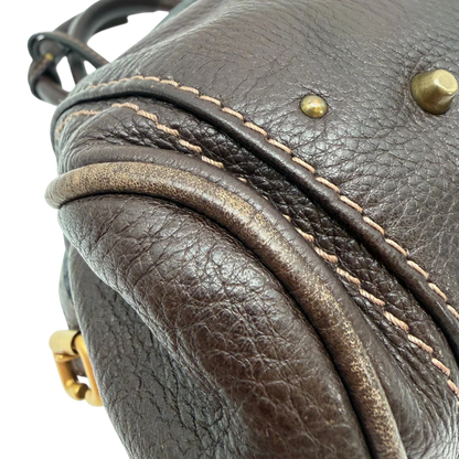 https://cdn.shopify.com/s/files/1/0564/9376/8855/files/Chloe_Handtasche_Paddington_aus_Leder_dunkelbraun_vintage6989.webp?v=1779290037