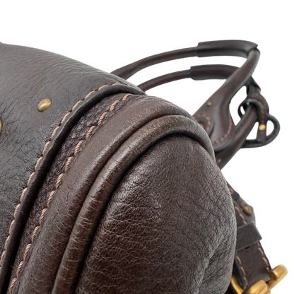https://cdn.shopify.com/s/files/1/0564/9376/8855/files/Chloe_Handtasche_Paddington_aus_Leder_dunkelbraun_vintage6990.webp?v=1779290033