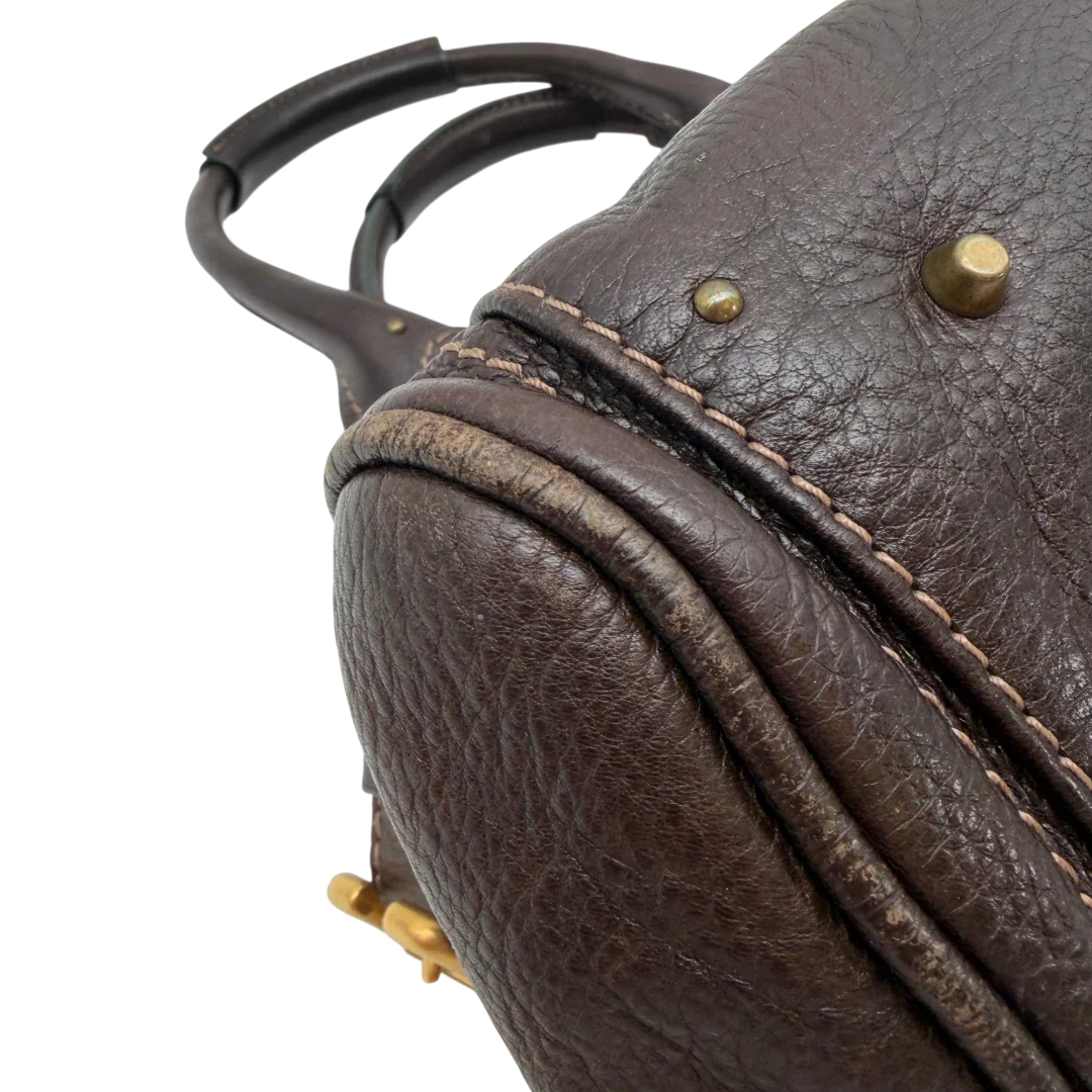 https://cdn.shopify.com/s/files/1/0564/9376/8855/files/Chloe_Handtasche_Paddington_aus_Leder_dunkelbraun_vintage6991.webp?v=1779290033