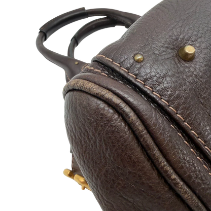 https://cdn.shopify.com/s/files/1/0564/9376/8855/files/Chloe_Handtasche_Paddington_aus_Leder_dunkelbraun_vintage6991.webp?v=1779290033