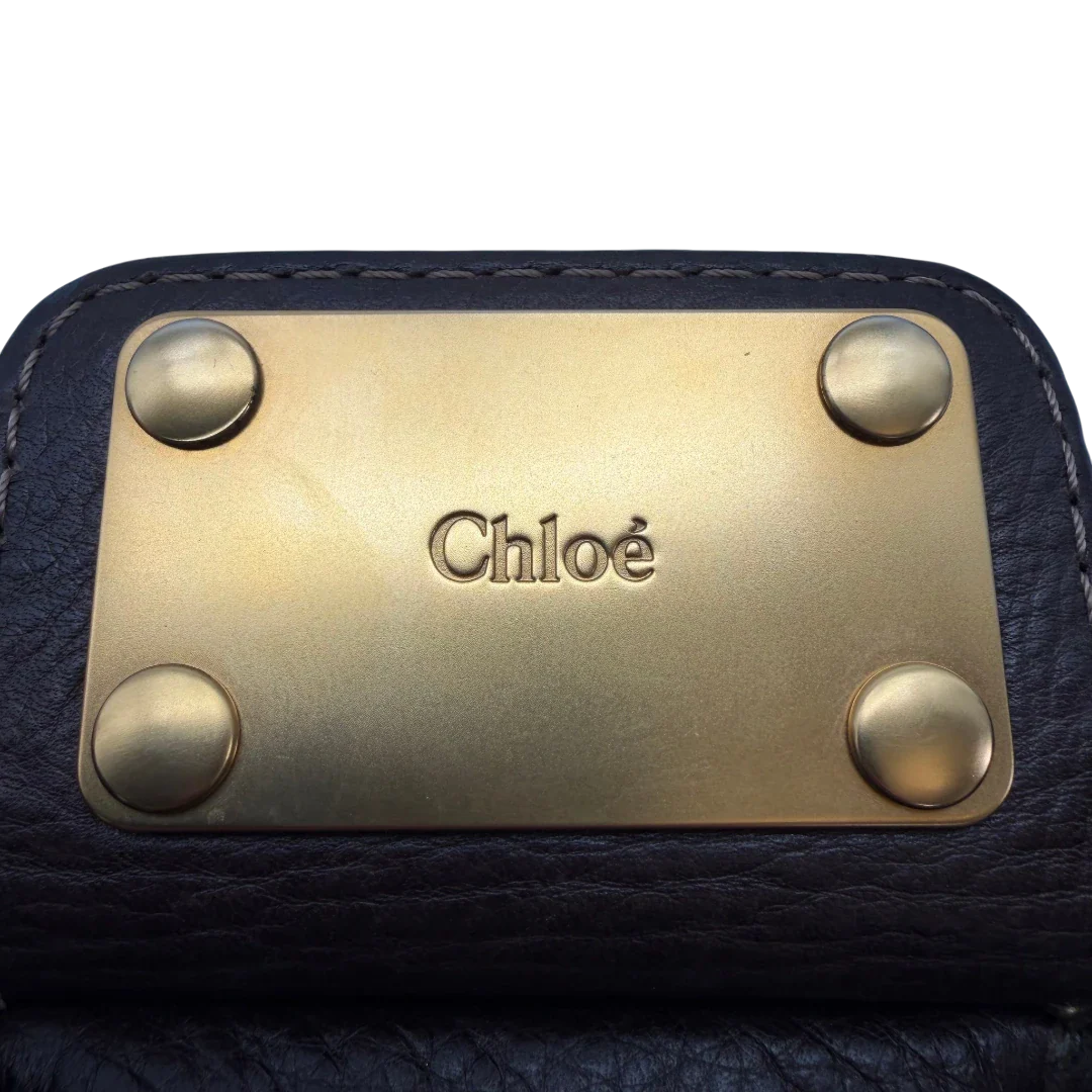 https://cdn.shopify.com/s/files/1/0564/9376/8855/files/Chloe_Handtasche_Paddington_aus_Leder_dunkelbraun_vintage6997.webp?v=1779290033