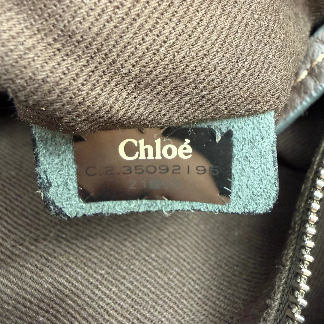 https://cdn.shopify.com/s/files/1/0564/9376/8855/files/Chloe_Handtasche_Paddington_aus_Leder_dunkelbraun_vintage6999.webp?v=1779290034