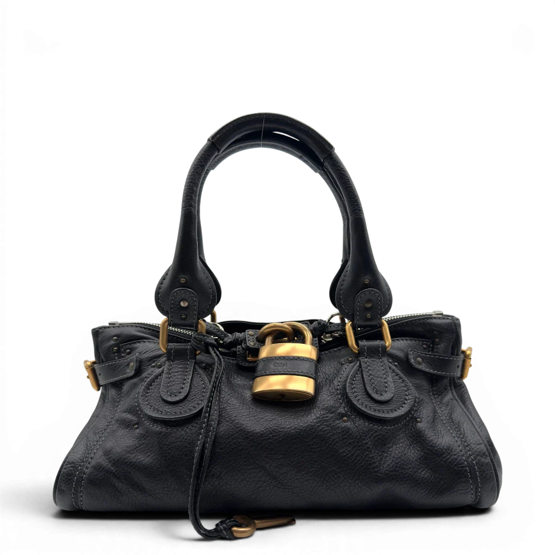 https://cdn.shopify.com/s/files/1/0564/9376/8855/files/Chloe_Handtasche_Paddington_aus_Leder_schwarz_vintage7224.webp?v=1778683779