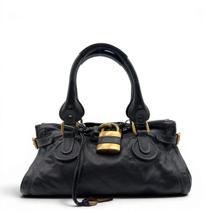 https://cdn.shopify.com/s/files/1/0564/9376/8855/files/Chloe_Handtasche_Paddington_aus_Leder_schwarz_vintage7224.webp?v=1778683779