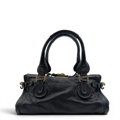 https://cdn.shopify.com/s/files/1/0564/9376/8855/files/Chloe_Handtasche_Paddington_aus_Leder_schwarz_vintage7225.webp?v=1778683778