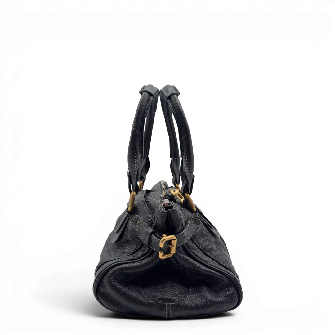 https://cdn.shopify.com/s/files/1/0564/9376/8855/files/Chloe_Handtasche_Paddington_aus_Leder_schwarz_vintage7226.webp?v=1778683778