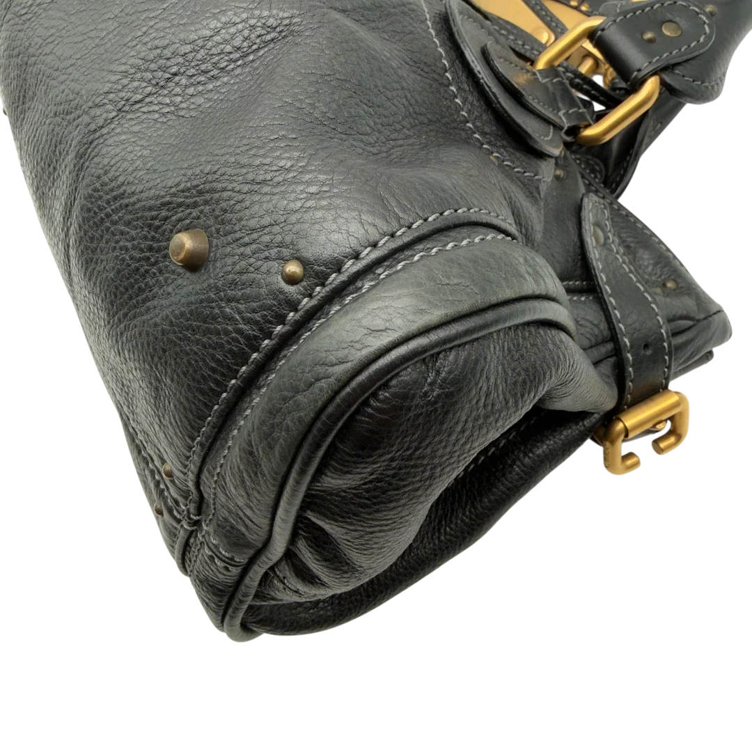 https://cdn.shopify.com/s/files/1/0564/9376/8855/files/Chloe_Handtasche_Paddington_aus_Leder_schwarz_vintage7229.webp?v=1778683779