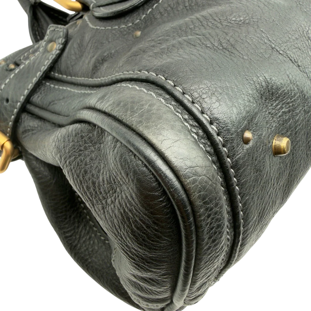 https://cdn.shopify.com/s/files/1/0564/9376/8855/files/Chloe_Handtasche_Paddington_aus_Leder_schwarz_vintage7230.webp?v=1778683779