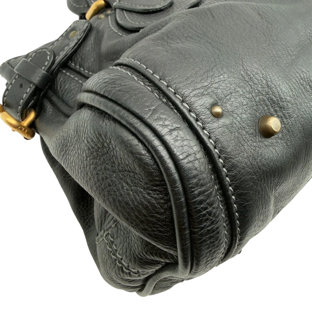 https://cdn.shopify.com/s/files/1/0564/9376/8855/files/Chloe_Handtasche_Paddington_aus_Leder_schwarz_vintage7232.webp?v=1778683779