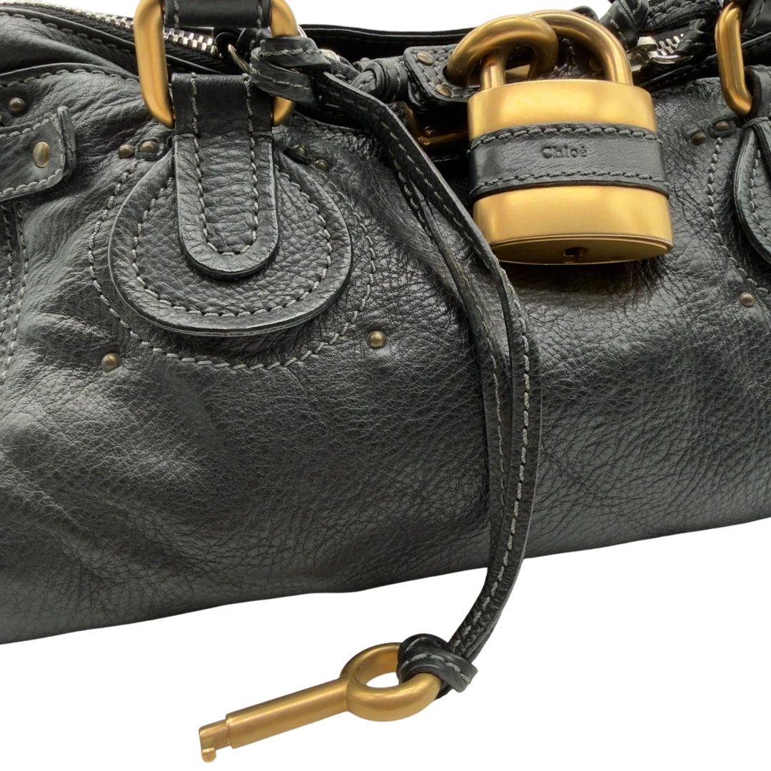 https://cdn.shopify.com/s/files/1/0564/9376/8855/files/Chloe_Handtasche_Paddington_aus_Leder_schwarz_vintage7235.webp?v=1778683779