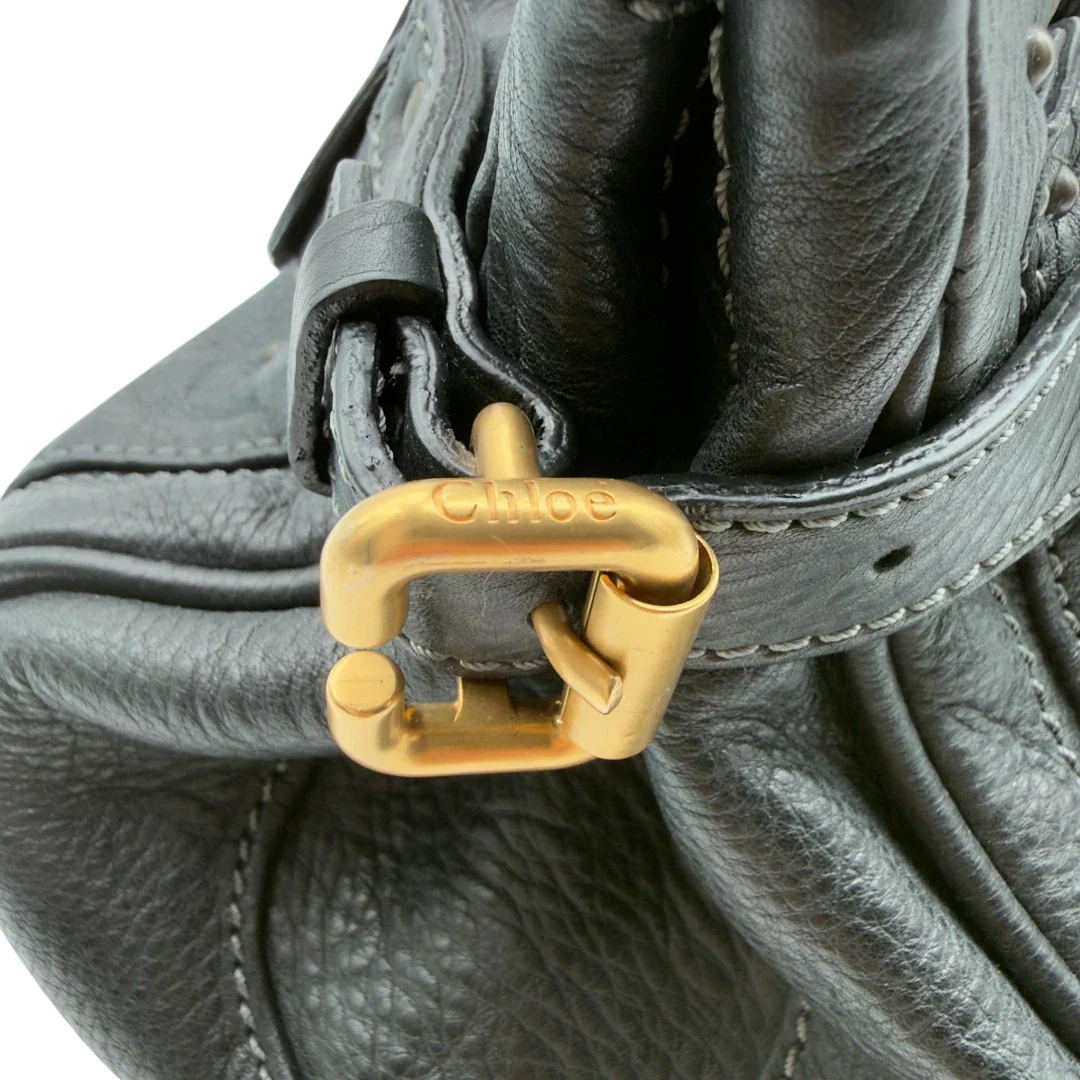 https://cdn.shopify.com/s/files/1/0564/9376/8855/files/Chloe_Handtasche_Paddington_aus_Leder_schwarz_vintage7236.webp?v=1778683779