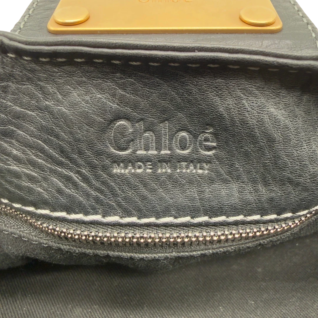https://cdn.shopify.com/s/files/1/0564/9376/8855/files/Chloe_Handtasche_Paddington_aus_Leder_schwarz_vintage7239.webp?v=1778683780