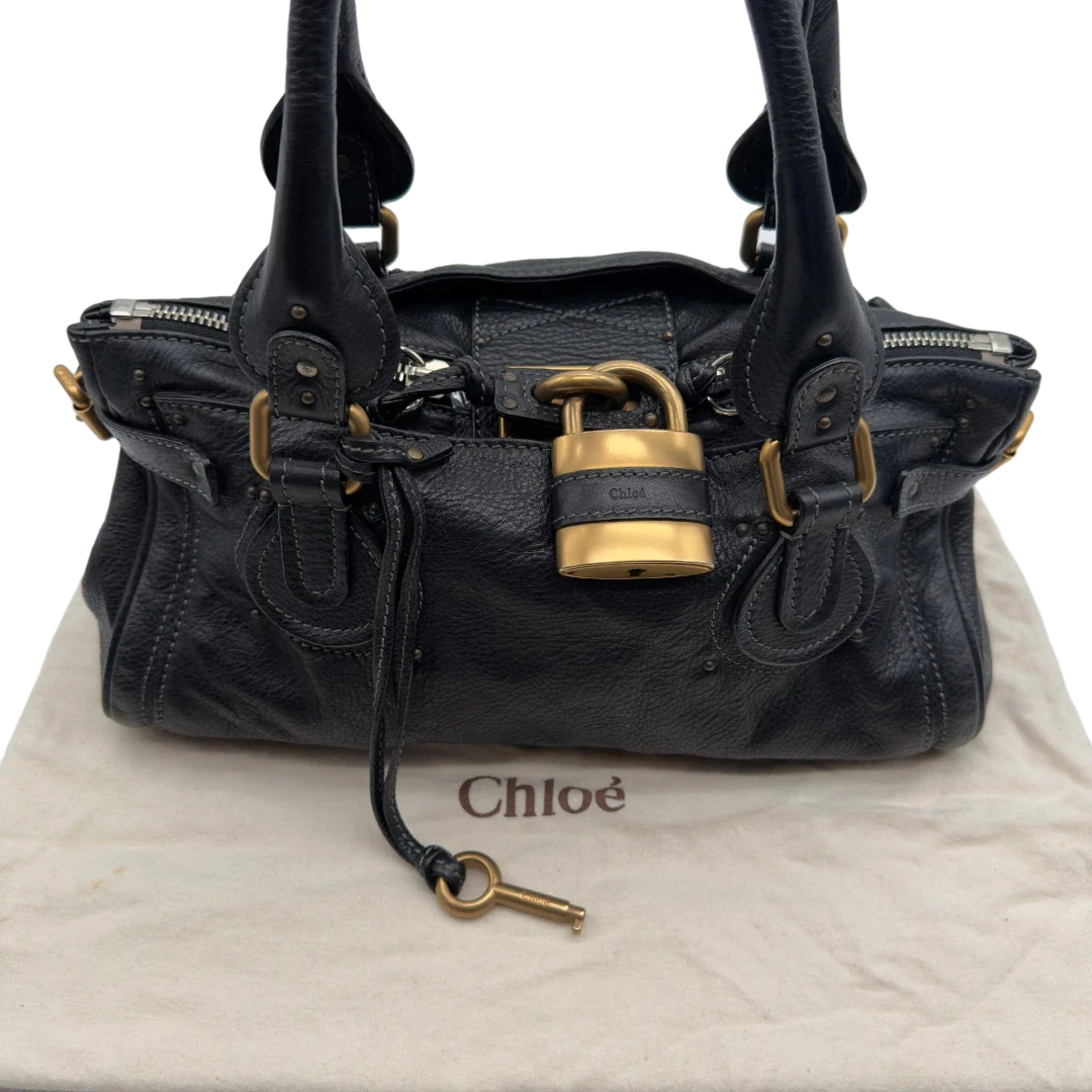 https://cdn.shopify.com/s/files/1/0564/9376/8855/files/Chloe_Handtasche_Paddington_aus_Leder_schwarz_vintage7241.webp?v=1778683779