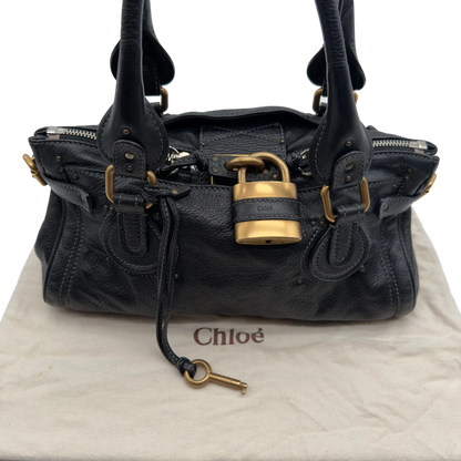 https://cdn.shopify.com/s/files/1/0564/9376/8855/files/Chloe_Handtasche_Paddington_aus_Leder_schwarz_vintage7241.webp?v=1778683779