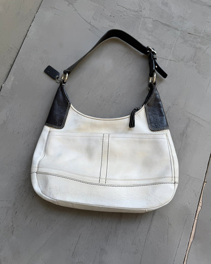 Coach Two Tone Leather Shoulder Bag-on a concrete background