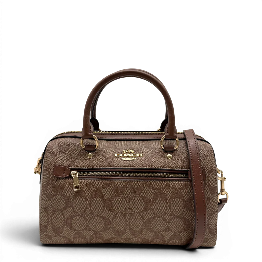 https://cdn.shopify.com/s/files/1/0564/9376/8855/files/Coach_Handtasche_Boston_25_mit_Umhangegurt_Signature_braun_vintage6437.webp?v=1778673462