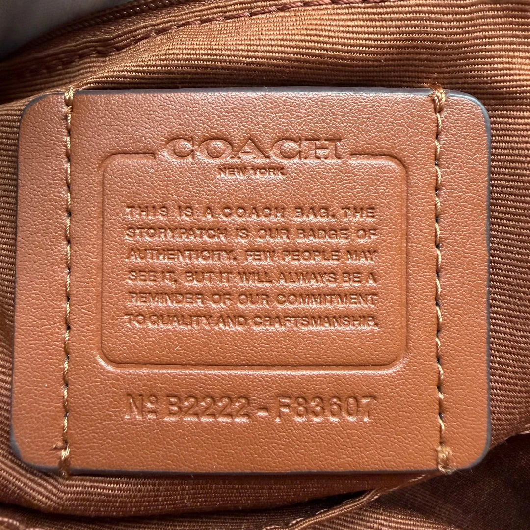 https://cdn.shopify.com/s/files/1/0564/9376/8855/files/Coach_Handtasche_Boston_25_mit_Umhangegurt_Signature_braun_vintage6454.webp?v=1778673463