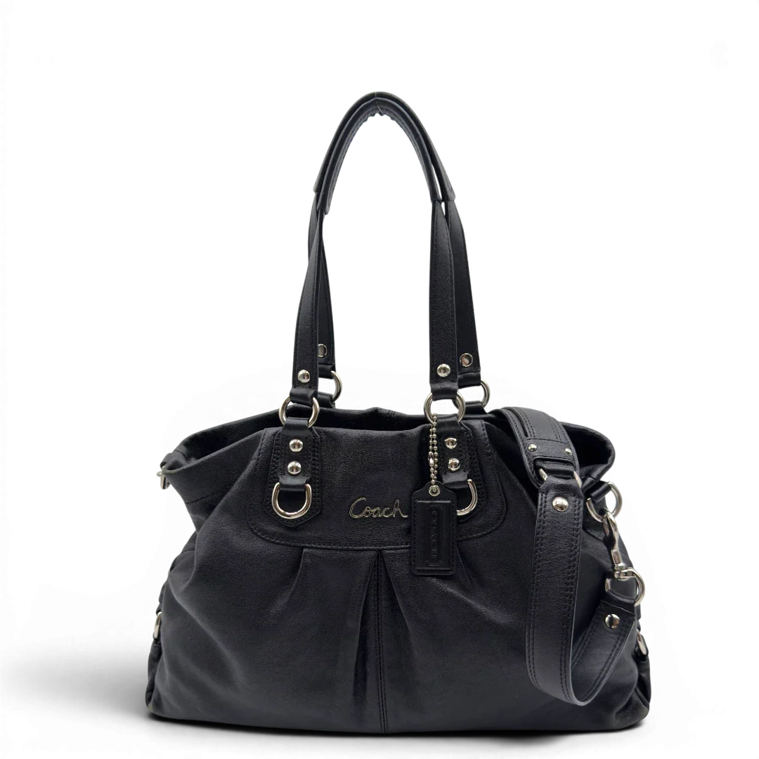 https://cdn.shopify.com/s/files/1/0564/9376/8855/files/Coach_Handtasche_Carryall_mit_Umhangegurt_aus_Leder_schwarz_1.webp?v=1782385670