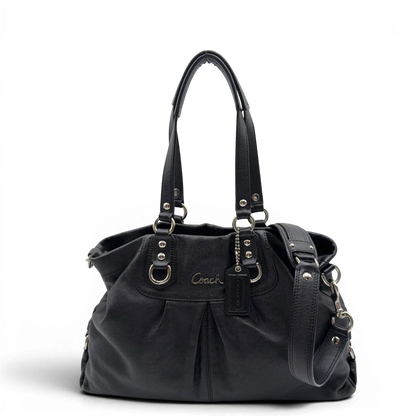 https://cdn.shopify.com/s/files/1/0564/9376/8855/files/Coach_Handtasche_Carryall_mit_Umhangegurt_aus_Leder_schwarz_1.webp?v=1782385670