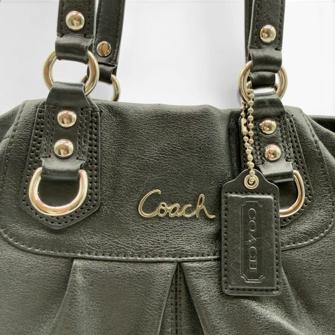 https://cdn.shopify.com/s/files/1/0564/9376/8855/files/Coach_Handtasche_Carryall_mit_Umhangegurt_aus_Leder_schwarz_11.webp?v=1782385671
