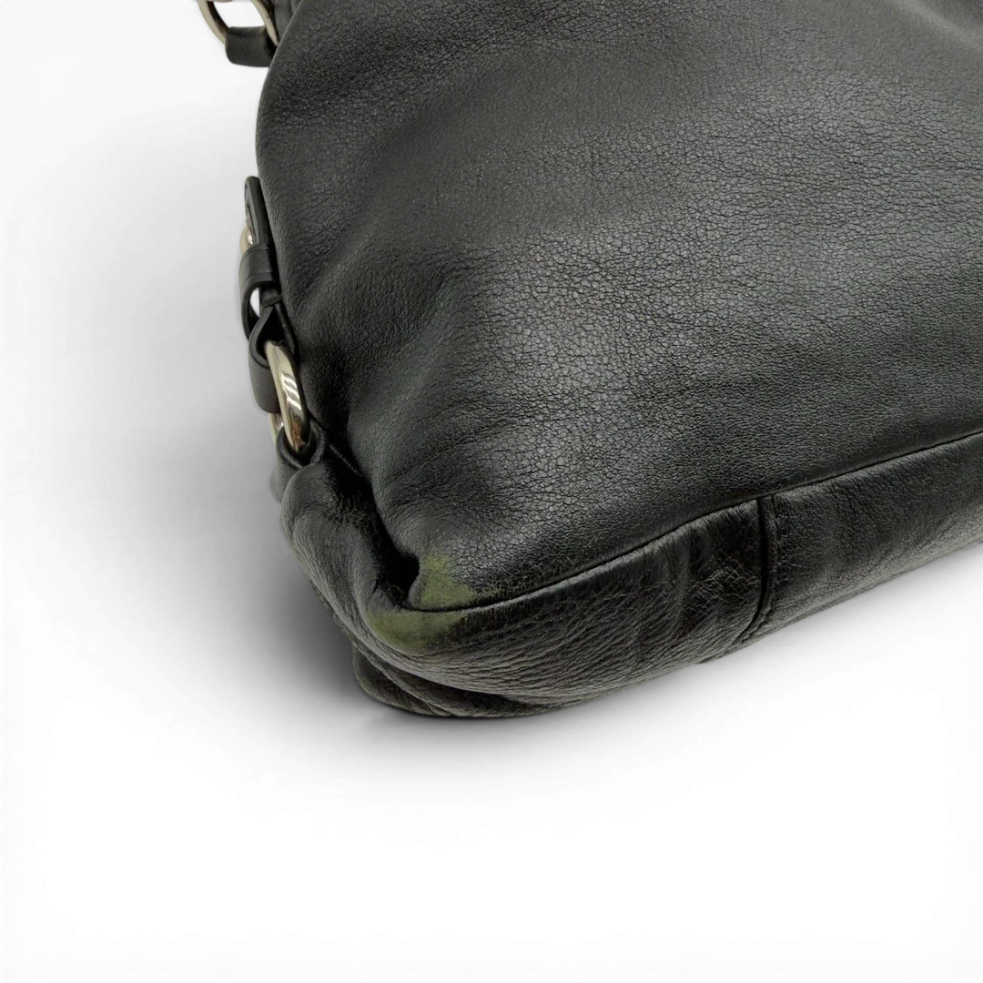 https://cdn.shopify.com/s/files/1/0564/9376/8855/files/Coach_Handtasche_Carryall_mit_Umhangegurt_aus_Leder_schwarz_7.webp?v=1782385670