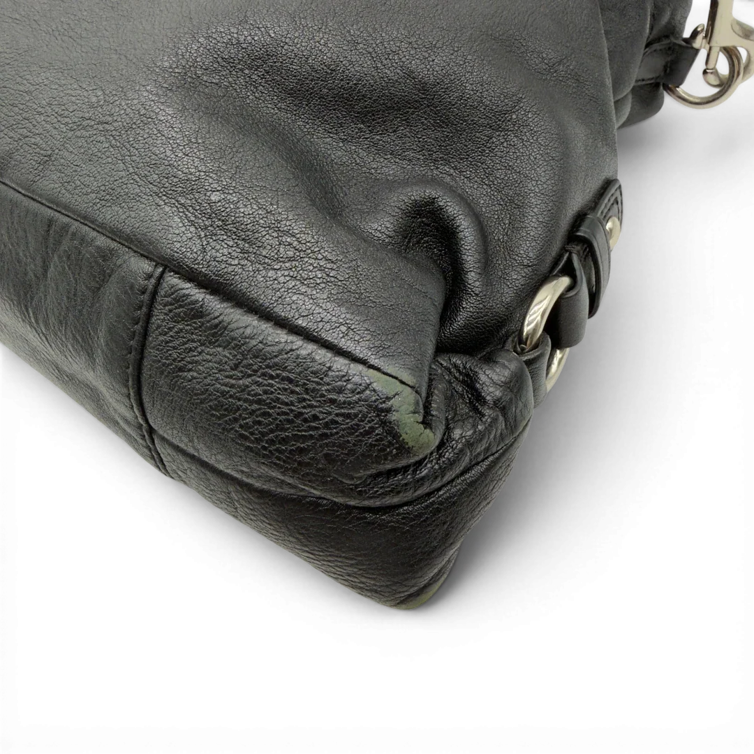 https://cdn.shopify.com/s/files/1/0564/9376/8855/files/Coach_Handtasche_Carryall_mit_Umhangegurt_aus_Leder_schwarz_8.webp?v=1782385670