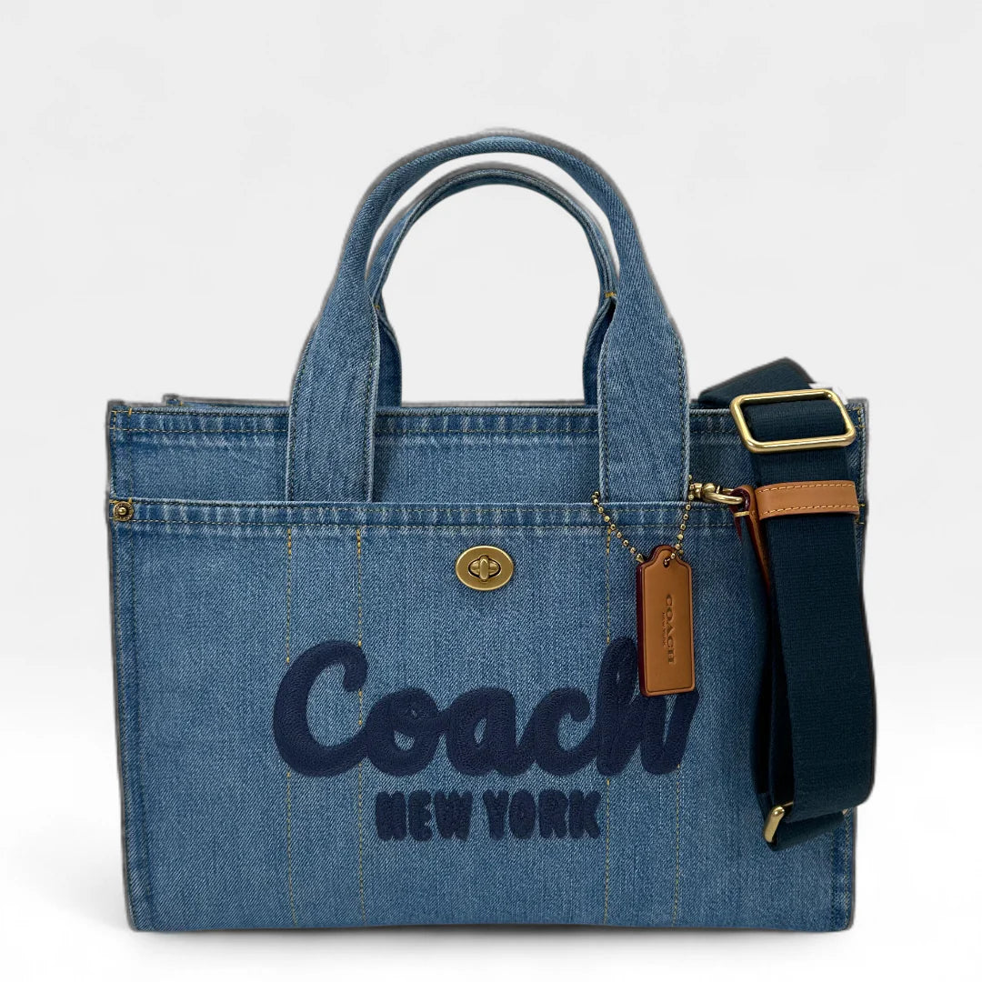 https://cdn.shopify.com/s/files/1/0564/9376/8855/files/Coach_Handtasche_Denim_Tote_bag_blau_vintage_handbag9430.webp?v=1761135786