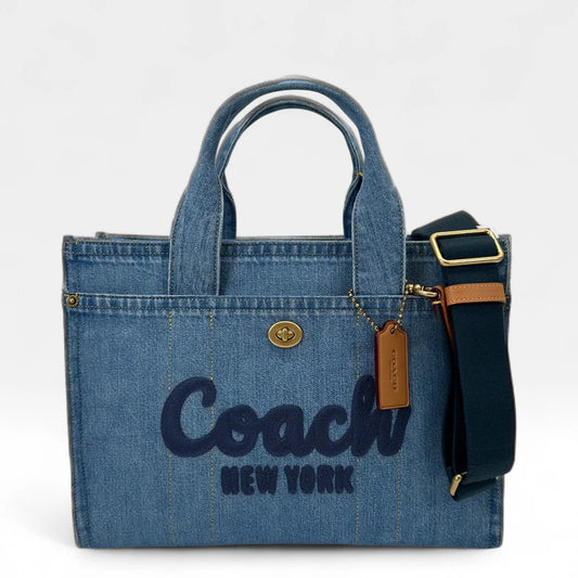 https://cdn.shopify.com/s/files/1/0564/9376/8855/files/Coach_Handtasche_Denim_Tote_bag_blau_vintage_handbag9430.webp?v=1761135786