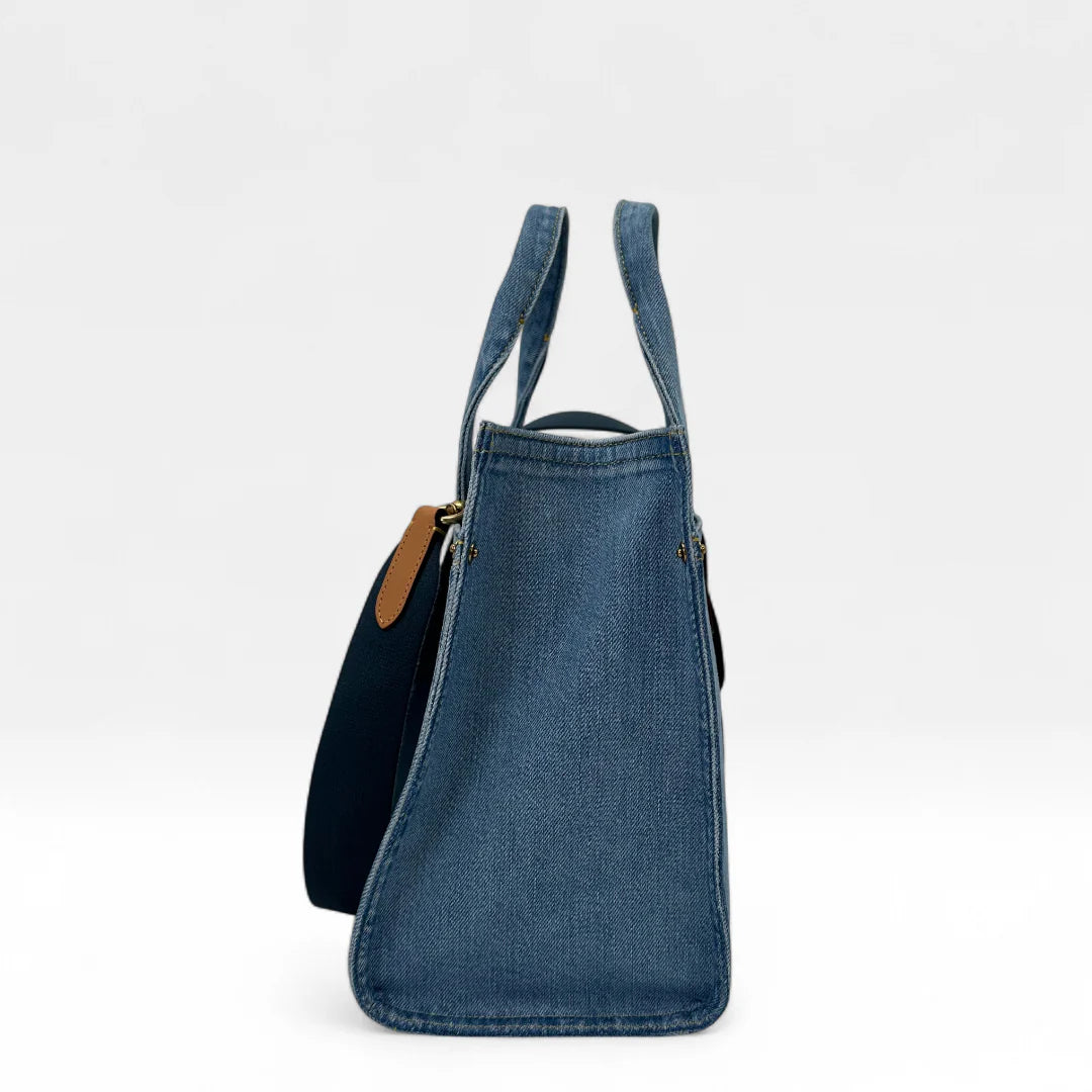 https://cdn.shopify.com/s/files/1/0564/9376/8855/files/Coach_Handtasche_Denim_Tote_bag_blau_vintage_handbag9432.webp?v=1761265739