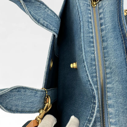https://cdn.shopify.com/s/files/1/0564/9376/8855/files/Coach_Handtasche_Denim_Tote_bag_blau_vintage_handbag9440.webp?v=1761265739