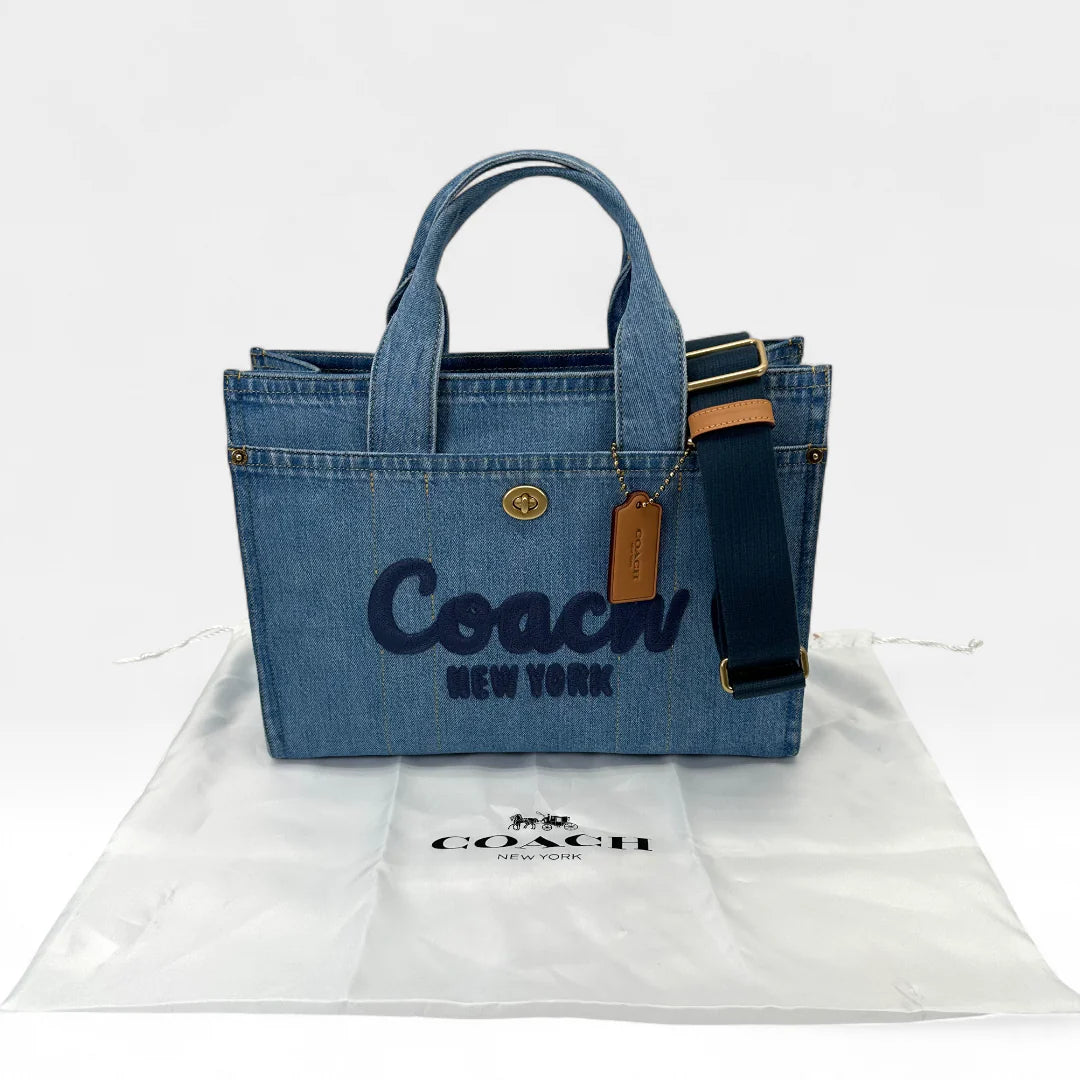 https://cdn.shopify.com/s/files/1/0564/9376/8855/files/Coach_Handtasche_Denim_Tote_bag_blau_vintage_handbag9444.webp?v=1761265739