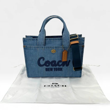 https://cdn.shopify.com/s/files/1/0564/9376/8855/files/Coach_Handtasche_Denim_Tote_bag_blau_vintage_handbag9444.webp?v=1761265739