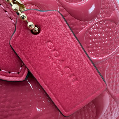https://cdn.shopify.com/s/files/1/0564/9376/8855/files/Coach_Handtasche_Mini_Boston_aus_Leder_pink_vintage_4553.webp?v=1765402369