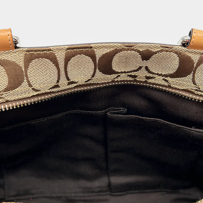 https://cdn.shopify.com/s/files/1/0564/9376/8855/files/Coach_Handtasche_Shopper_klein_Signature_beige_vintage_9876.webp?v=1765451205