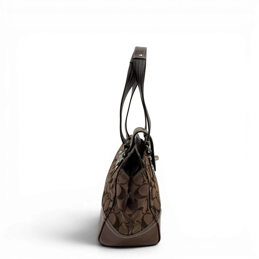 https://cdn.shopify.com/s/files/1/0564/9376/8855/files/Coach_Handtasche_Signature_braun_vintage4938.webp?v=1776850124
