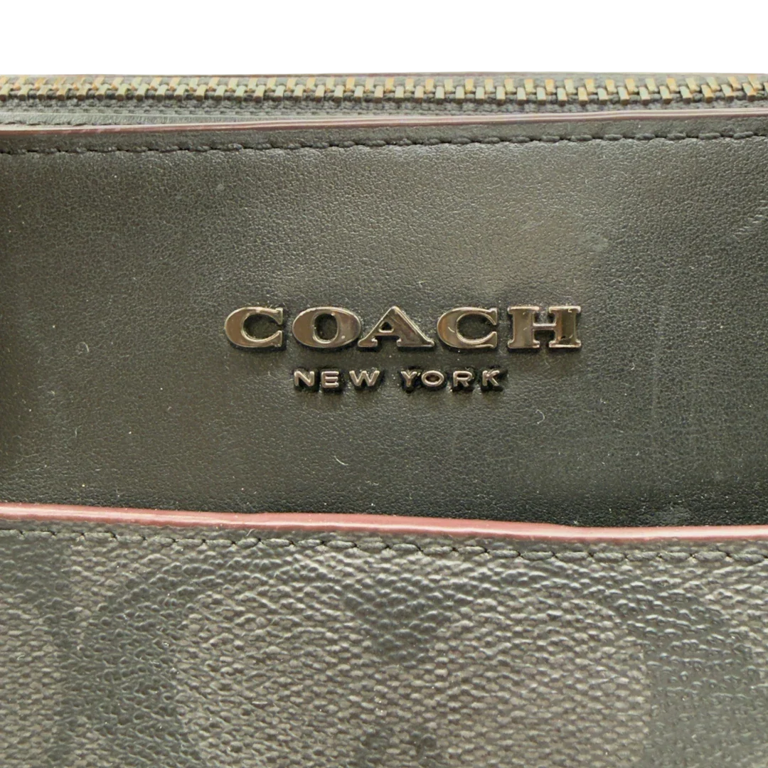 https://cdn.shopify.com/s/files/1/0564/9376/8855/files/Coach_Laptoptasche_Signature_schwarz_vintage8251.webp?v=1780409410