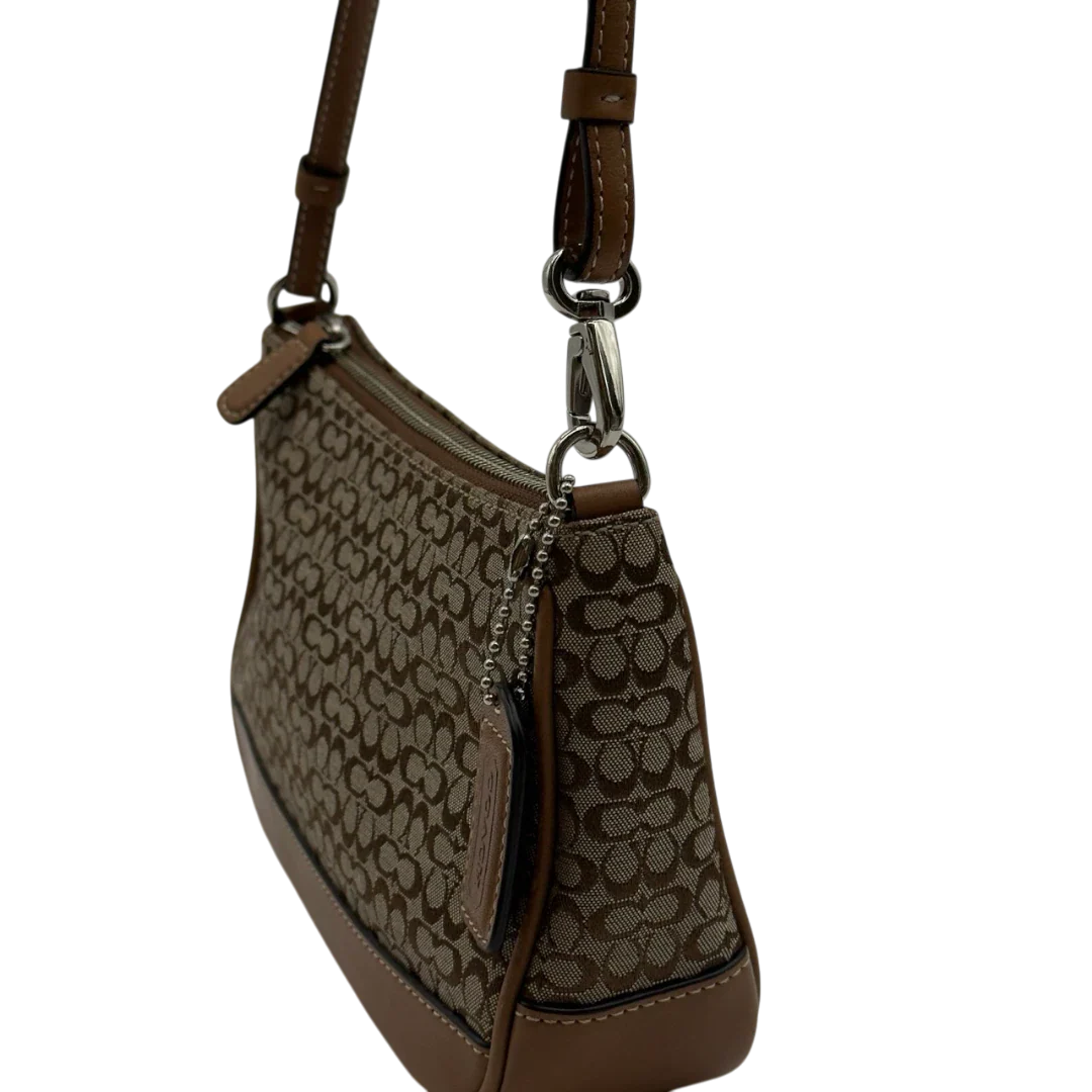 https://cdn.shopify.com/s/files/1/0564/9376/8855/files/Coach_Pochette_Mini_Signature_beige_13.webp?v=1784128021