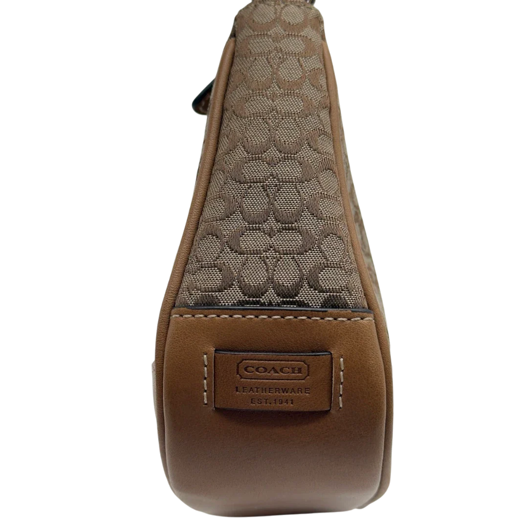 https://cdn.shopify.com/s/files/1/0564/9376/8855/files/Coach_Pochette_Mini_Signature_beige_15.webp?v=1784128021