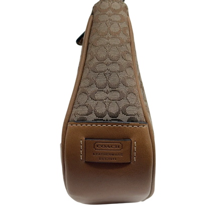 https://cdn.shopify.com/s/files/1/0564/9376/8855/files/Coach_Pochette_Mini_Signature_beige_15.webp?v=1784128021