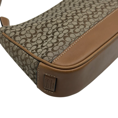 https://cdn.shopify.com/s/files/1/0564/9376/8855/files/Coach_Pochette_Mini_Signature_beige_9.webp?v=1784128021